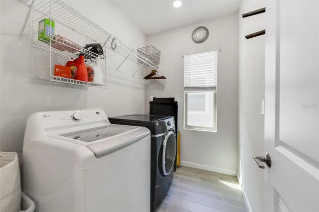 a utility room with dryer and washer