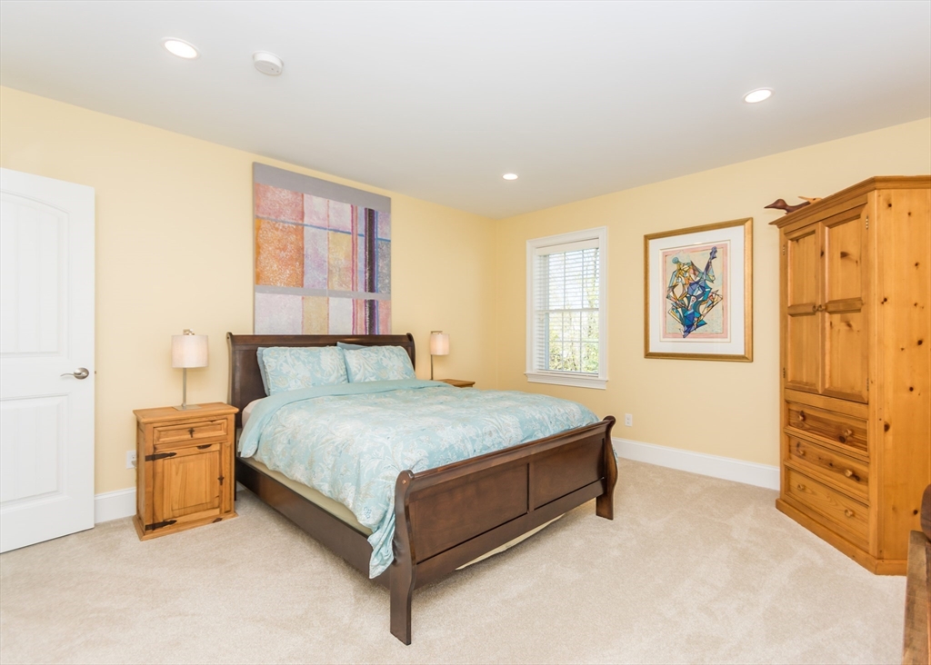 128 Church Street, Unit 2 Waltham, MA 02452 - Photo 18 of 41 a bedroom with a bed and dresser