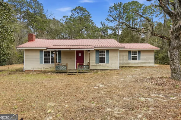 a front view of a house with yard