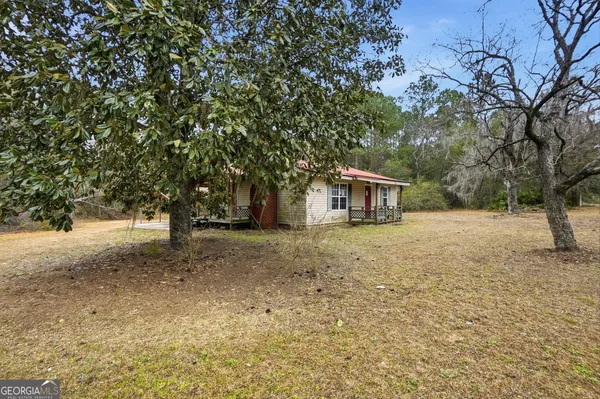 a house with trees in front of it