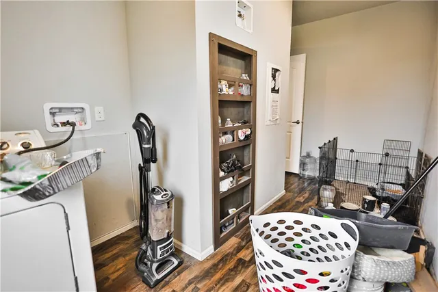 a bedroom with furniture and a rug