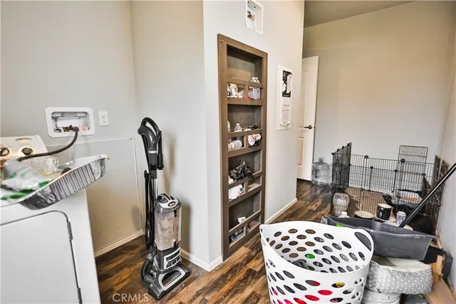 a bedroom with furniture and a rug