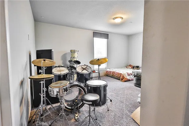 a living room with furniture and a lamp