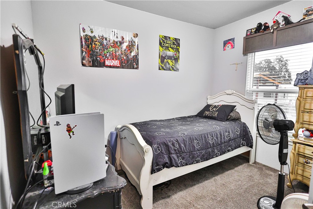 4210 Osborn Road Flournoy, CA 96021 - Photo 25 of 50 a bedroom with a bed and a window