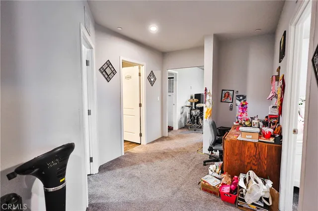 a view of kids room with toys and a couch