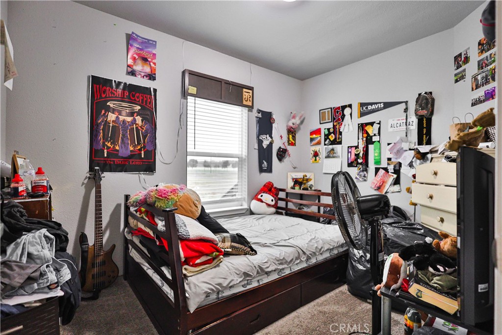 4210 Osborn Road Flournoy, CA 96021 - Photo 28 of 50 a bedroom with furniture and a bed