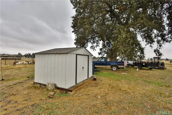 a view of a backyard of the house
