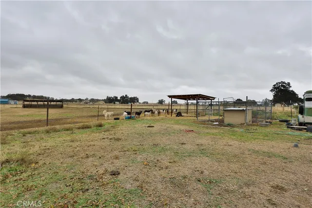 a view of a lake with houses in background