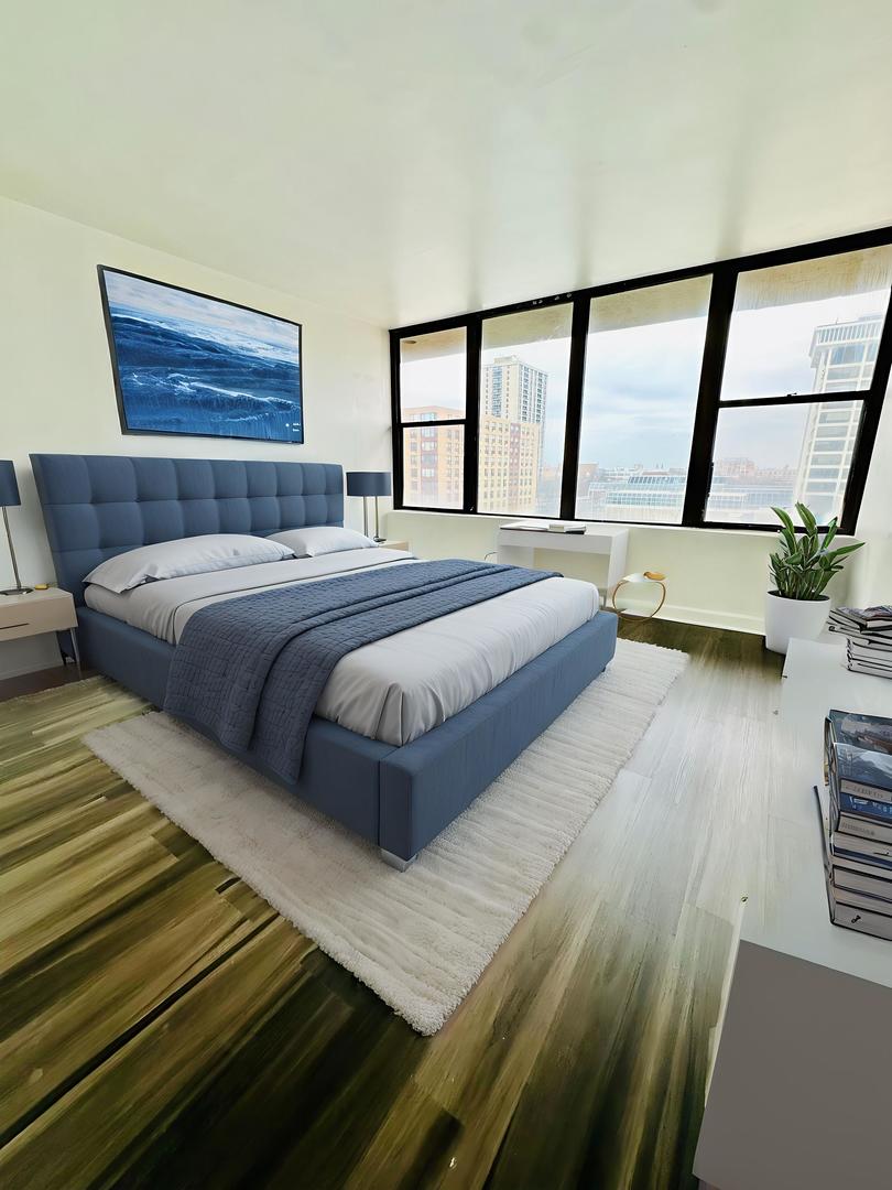 345 East Eastgate Place, Unit 602 Chicago, IL 60616 - Photo 12 of 13 a bedroom with a bed and a large window