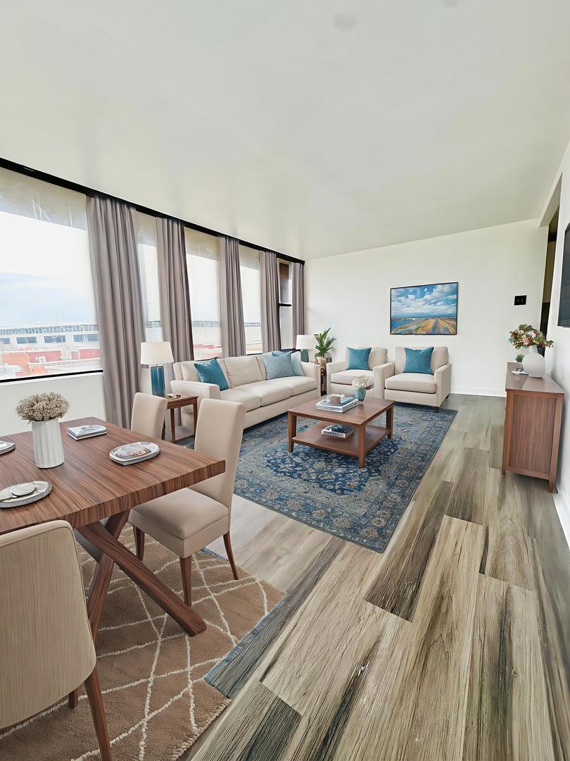 345 East Eastgate Place, Unit 602 Chicago, IL 60616 - Photo 10 of 13 a living room with furniture and a table