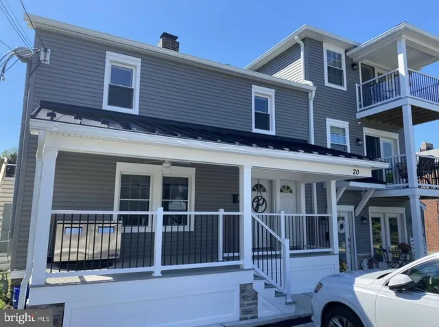 a front view of a house with glass windows