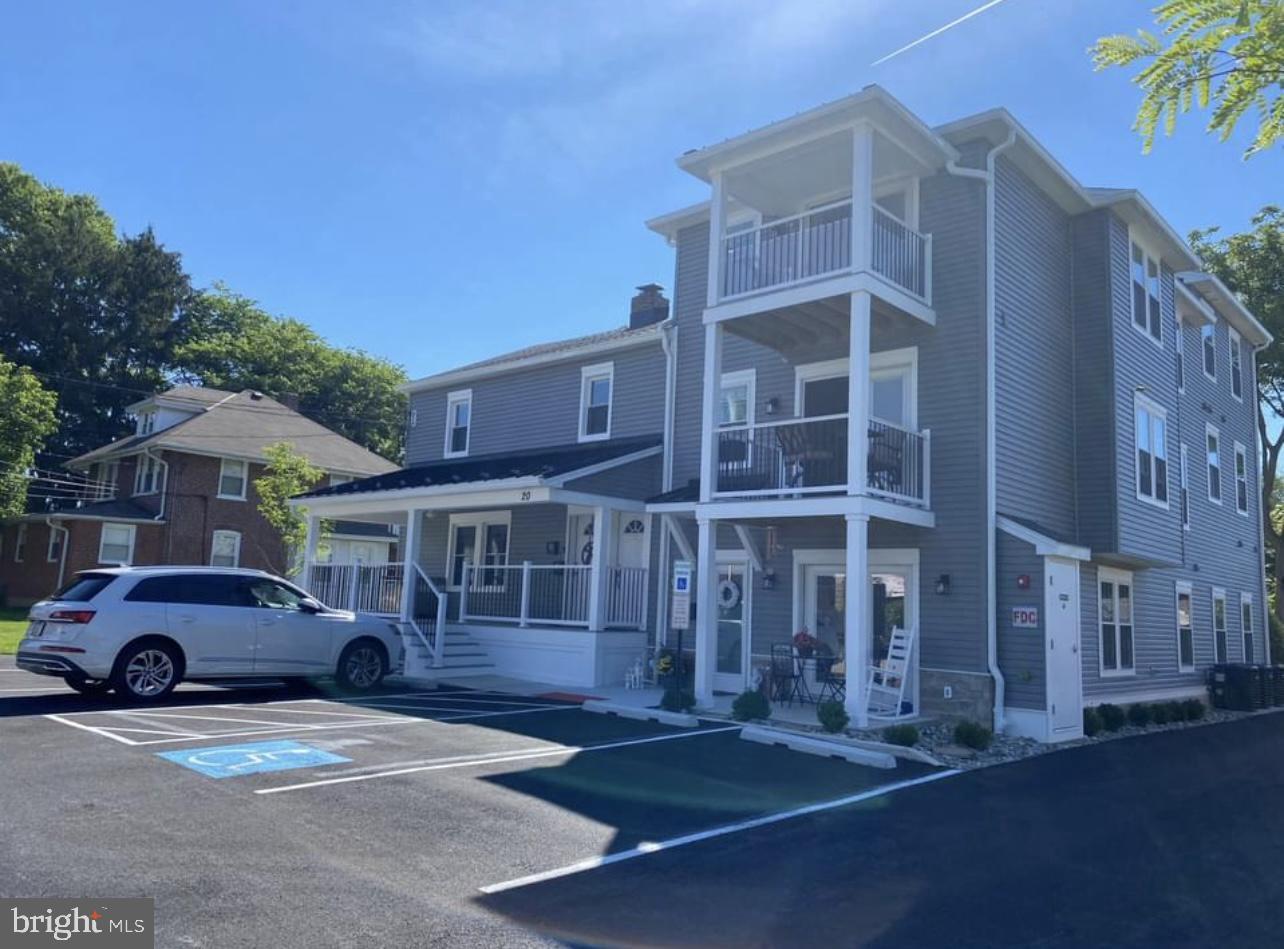 20 Reese Avenue, Unit 2 Newtown Square, PA 19073 - Photo 2 of 7 a car parked in front of a building
