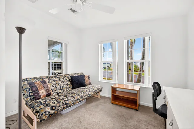 a bedroom with furniture and a window