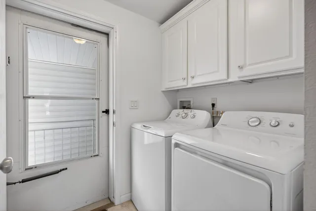 a view of storage and utility room with washer and dryer