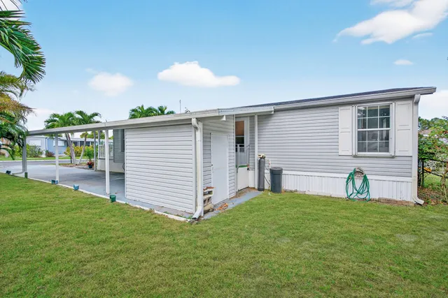 a view of a backyard with a garden and plants