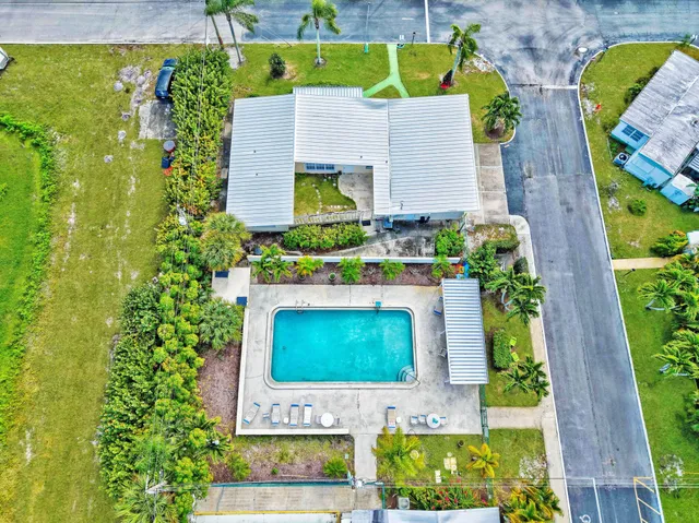 an aerial view of a house with a garden