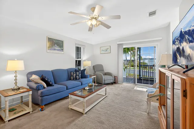 a living room with furniture fireplace and a flat screen tv