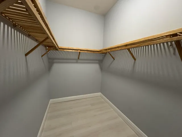 a view of a room with racks on the wall