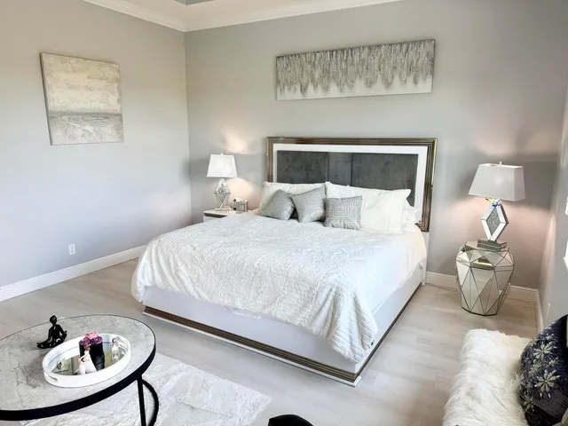 a bedroom with bed and a chair