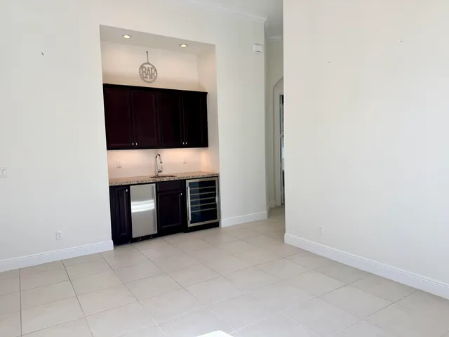 an empty room with kitchen