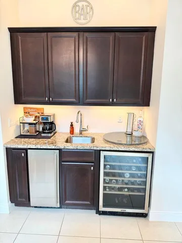 a kitchen with stainless steel appliances granite countertop wooden cabinets a stove and a microwave