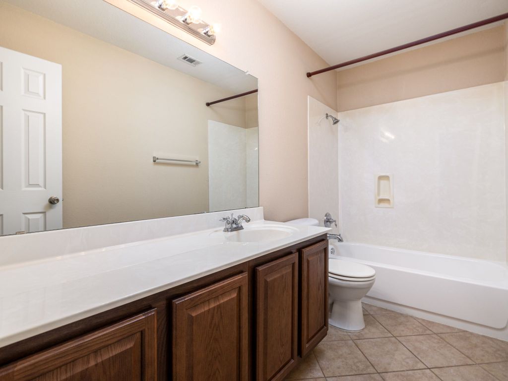 2005 Granite Springs Road Leander, TX 78641 - Photo 18 of 30 a bathroom with a sink a toilet and bathtub