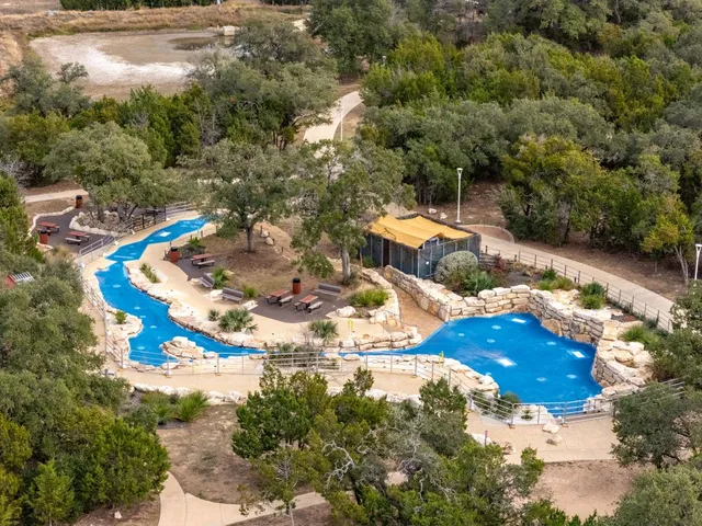an aerial view of residential building and ocean