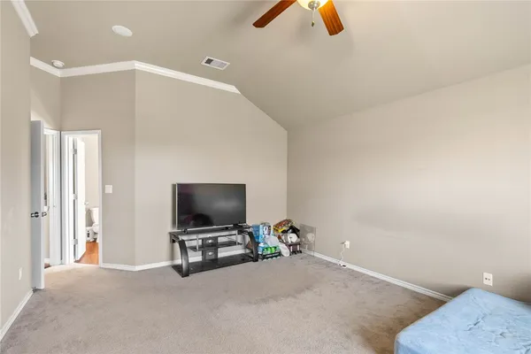 a view of a livingroom with furniture and a flat screen tv