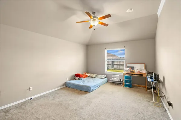 a view of work space with furniture and ceiling fan