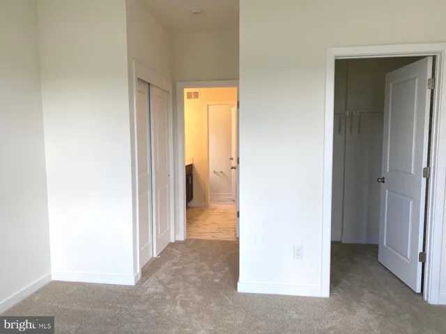 a view of a room with a hallway