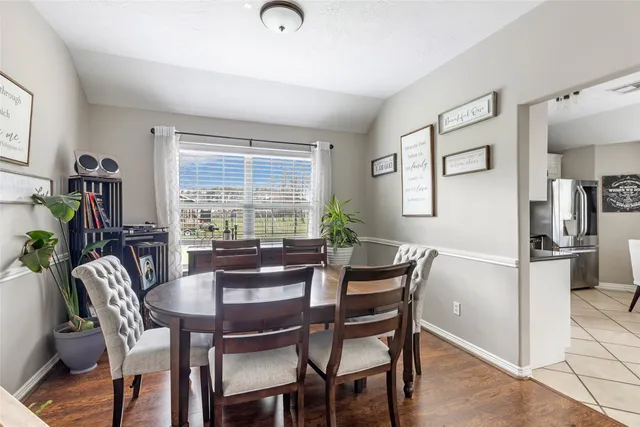 a dining room with furniture and window