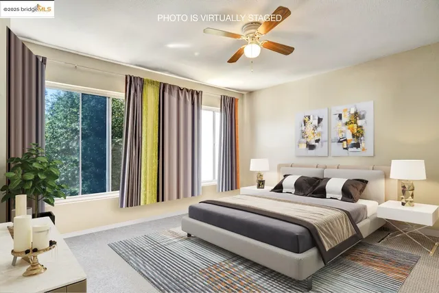 a bedroom with a large bed and a large window