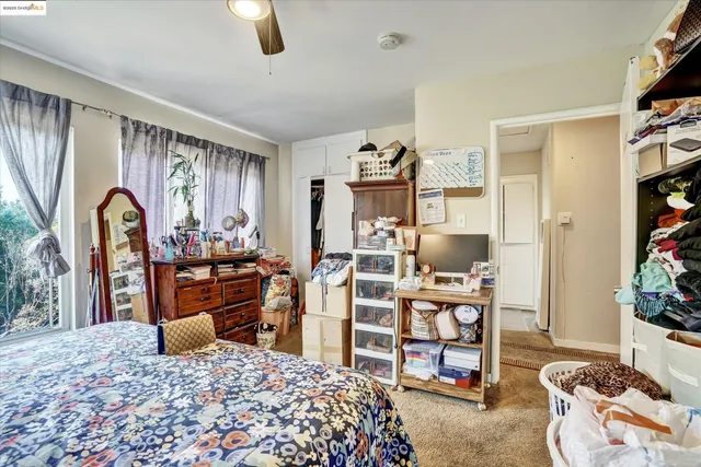 a bedroom with furniture and a window