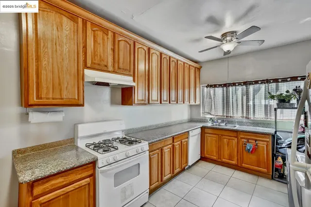 a kitchen with a sink cabinets and appliances