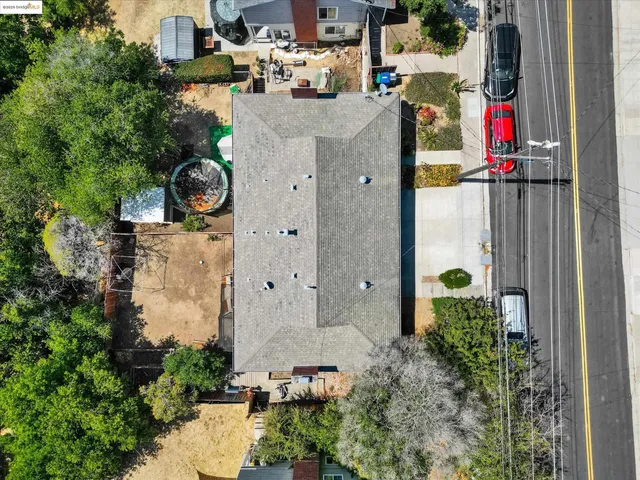 an aerial view of a house with outdoor space