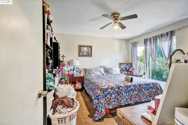 a bed room with furniture and a chandelier