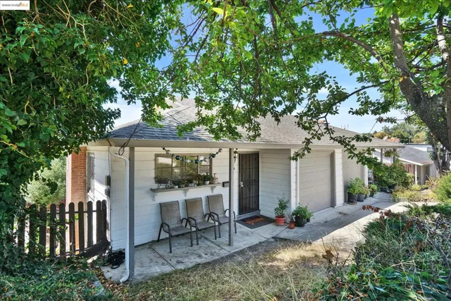 a front view of house with yard and seating area
