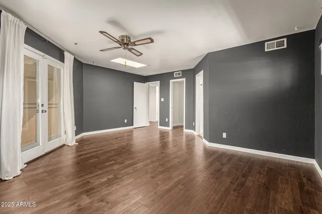 a view of two mirror with a sink