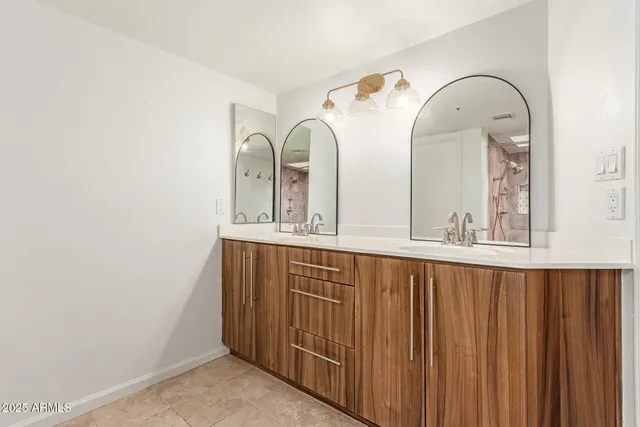 a bathroom with a shower and a sink