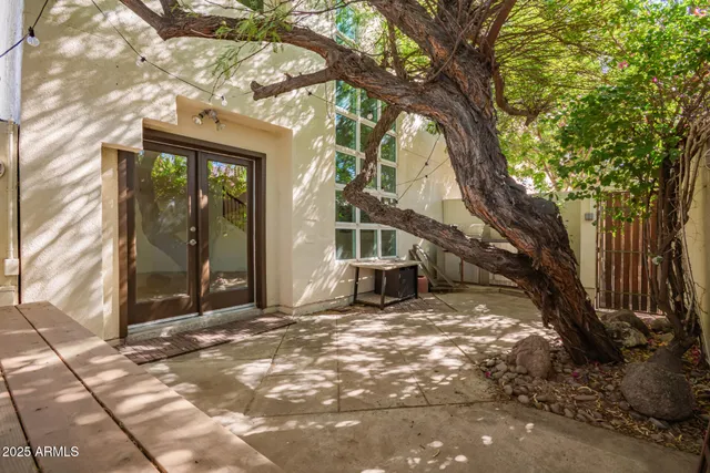 a swimming pool with outdoor seating and plants