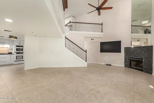 a view of an empty room with a fireplace
