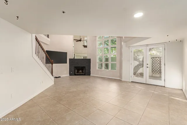 a view of livingroom with furniture and workspace