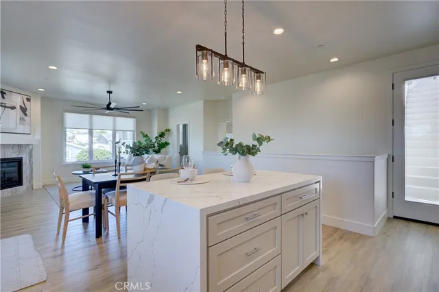 a kitchen with white cabinets white appliances sink and dishwasher