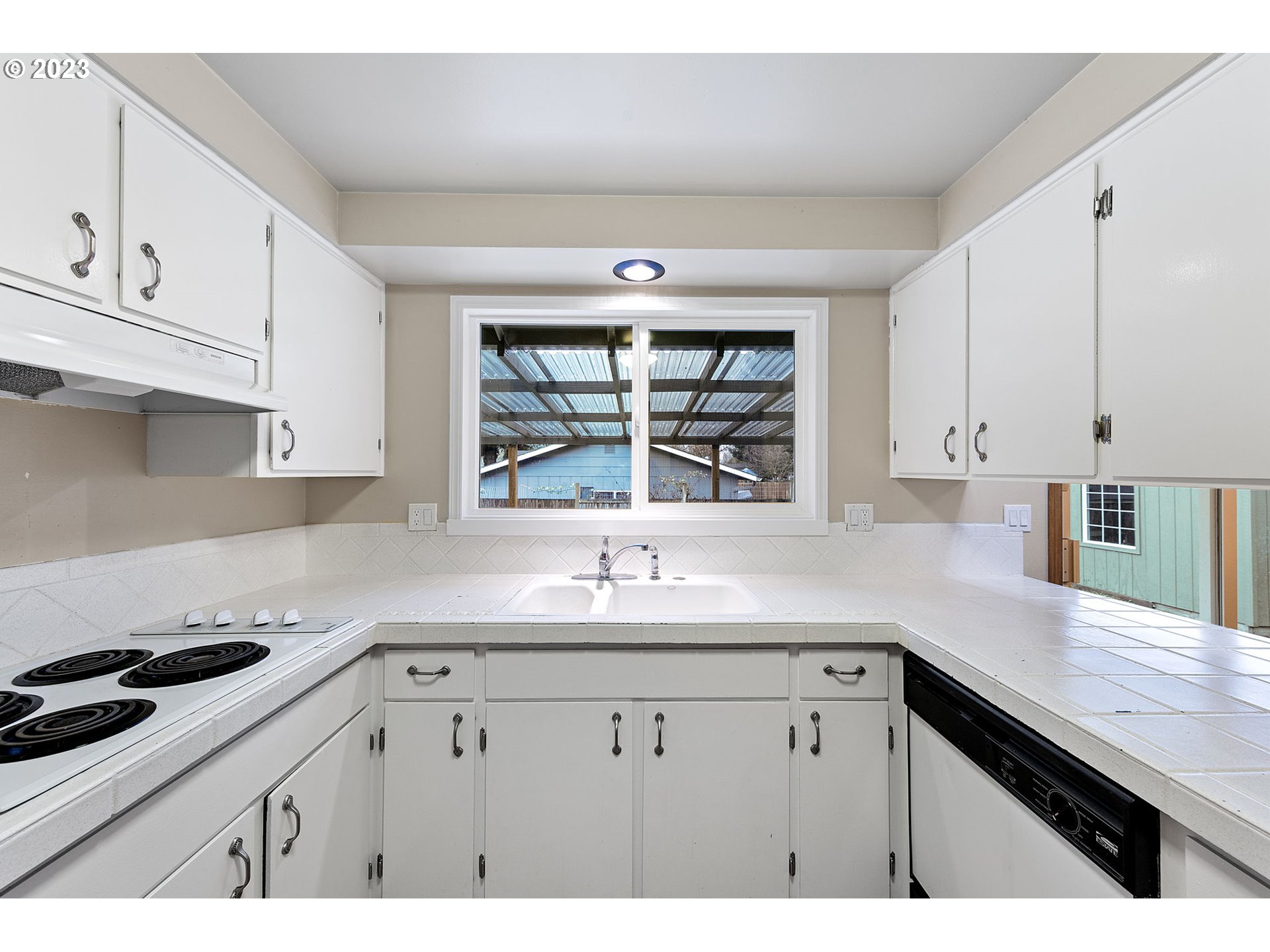 788 70th Street Springfield, OR 97478 - Photo 11 of 39 a kitchen with a sink cabinets and window