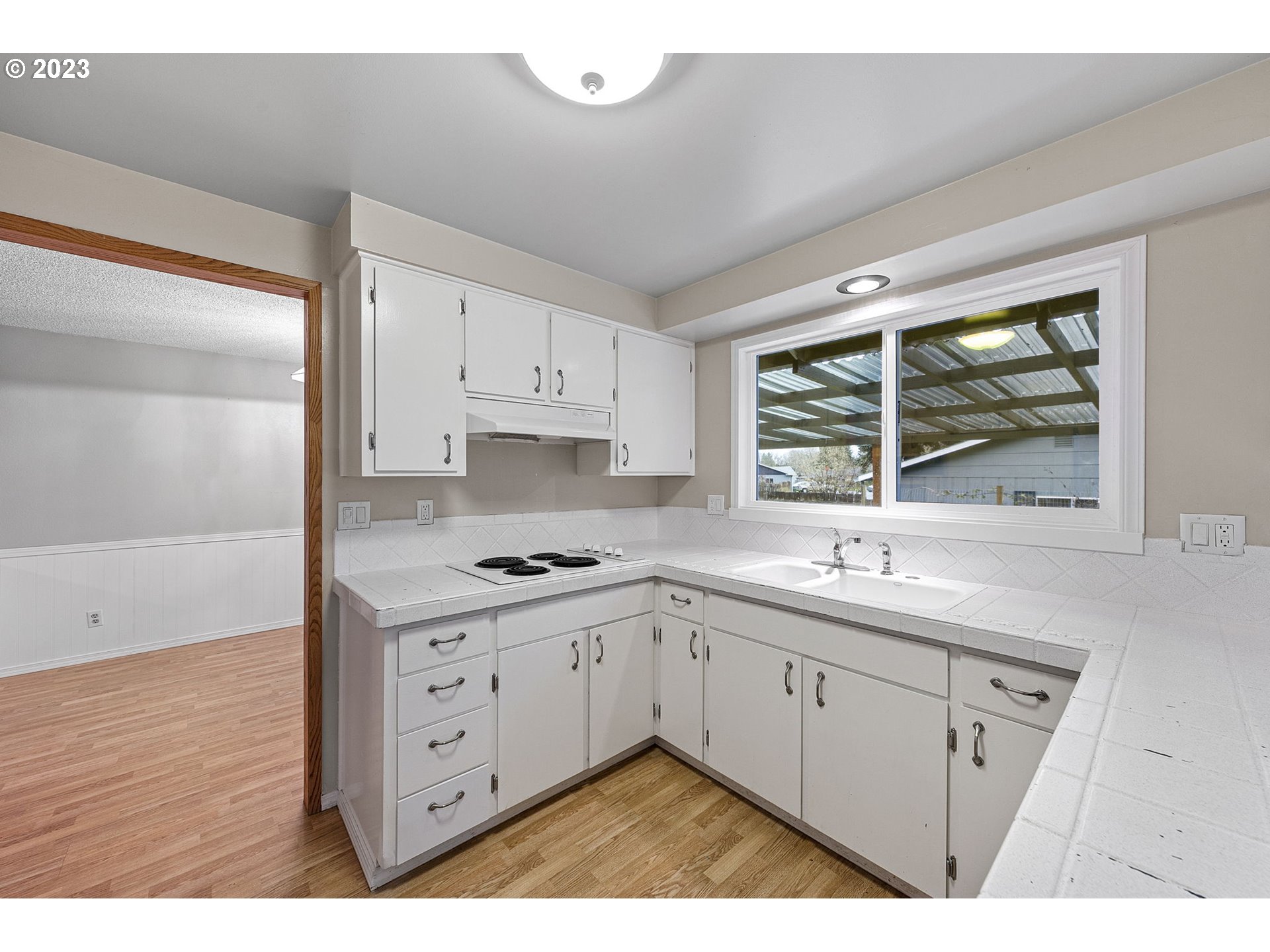 788 70th Street Springfield, OR 97478 - Photo 12 of 39 a kitchen with a sink stove and cabinets