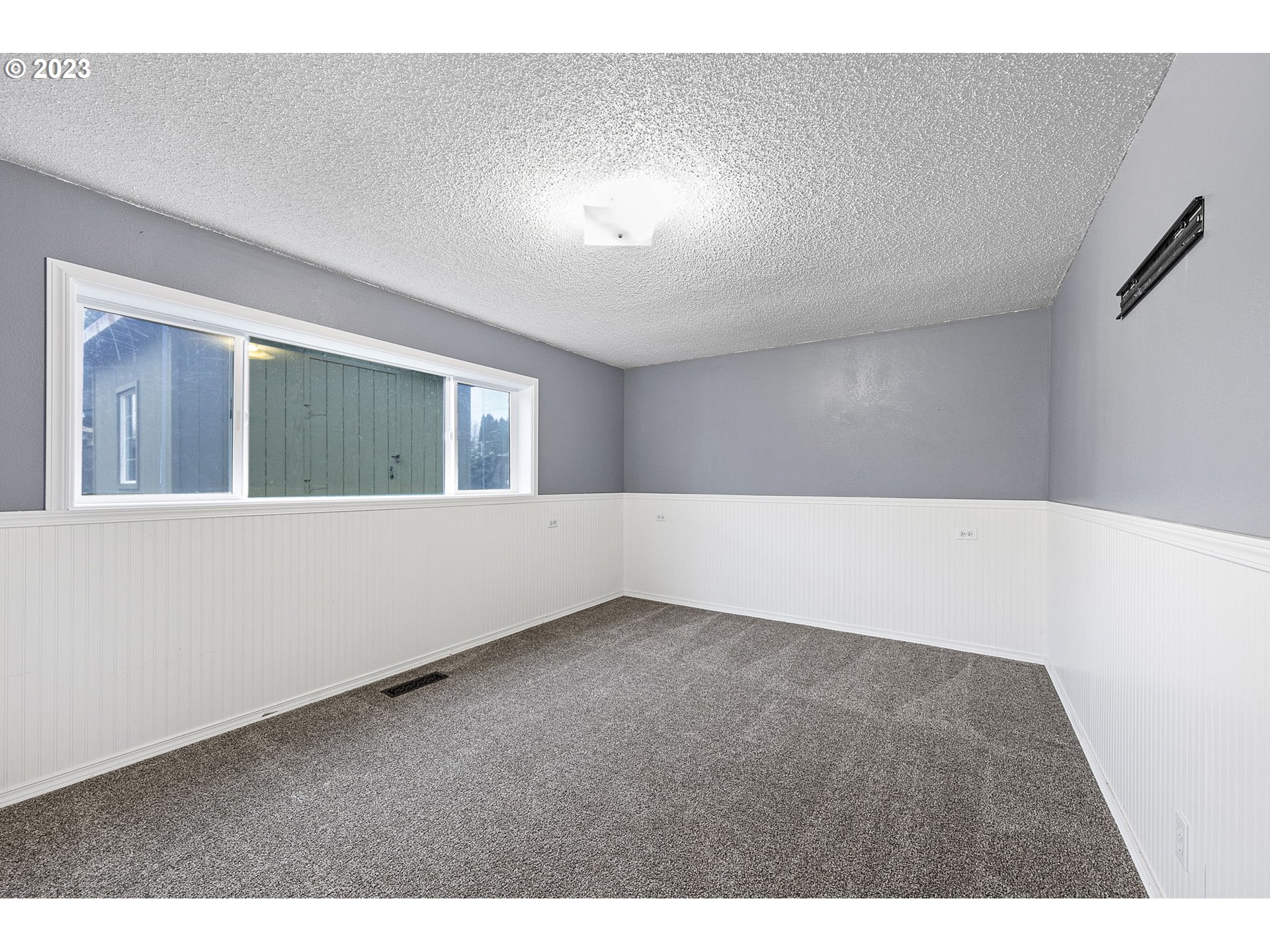 788 70th Street Springfield, OR 97478 - Photo 16 of 39 a view of an empty room with a window