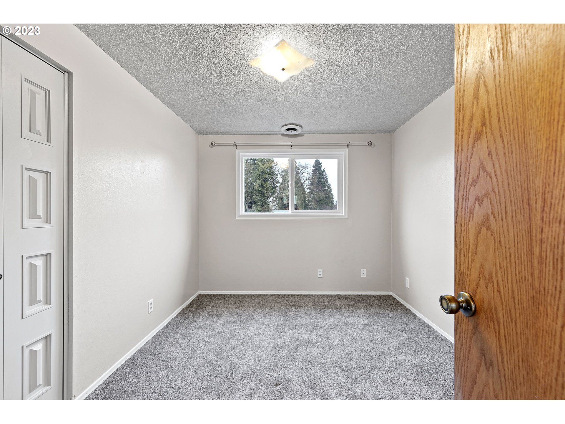 788 70th Street Springfield, OR 97478 - Photo 23 of 39 a view of an empty room with a window
