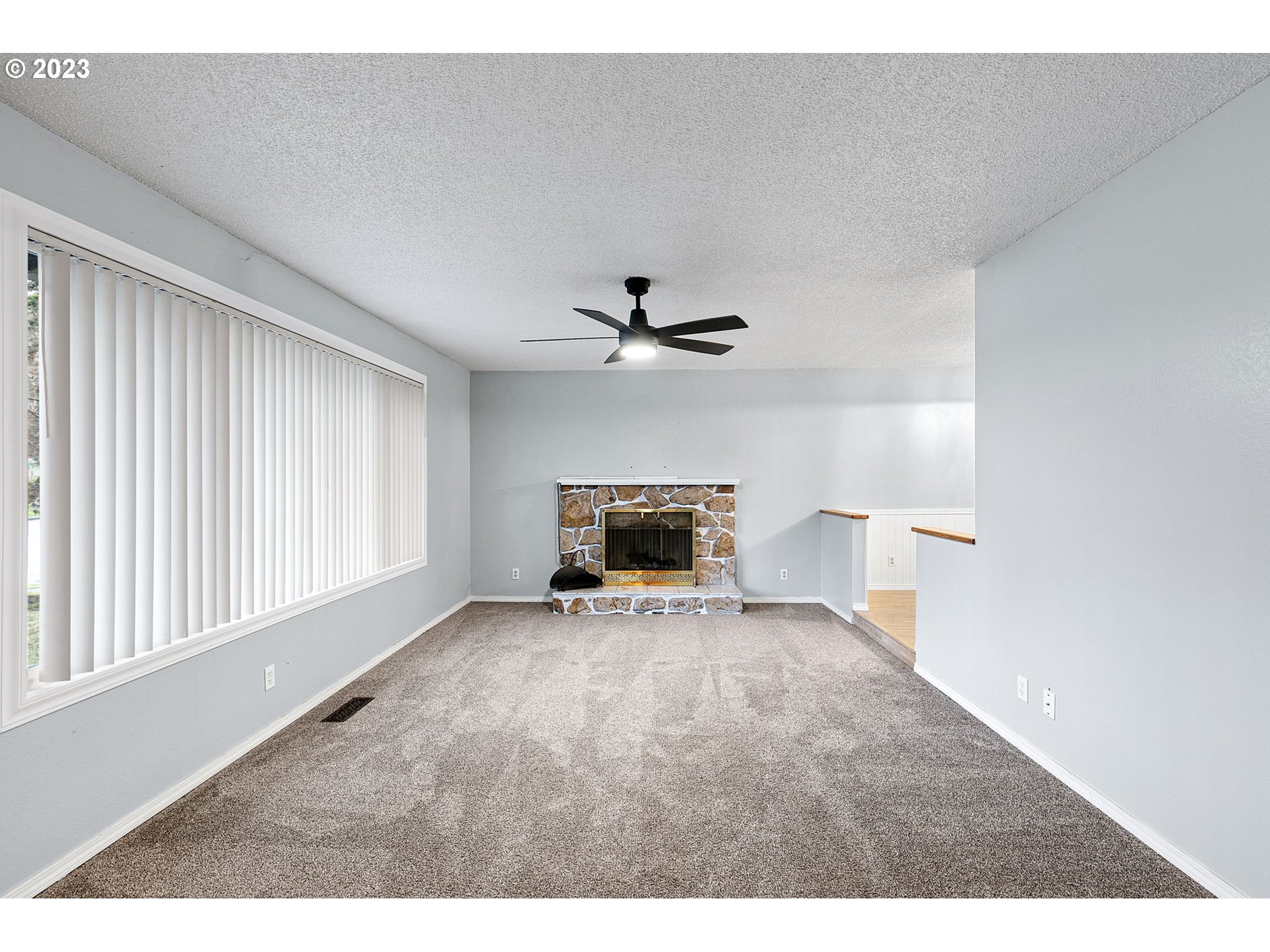 788 70th Street Springfield, OR 97478 - Photo 6 of 39 a view of a livingroom with a ceiling fan and window