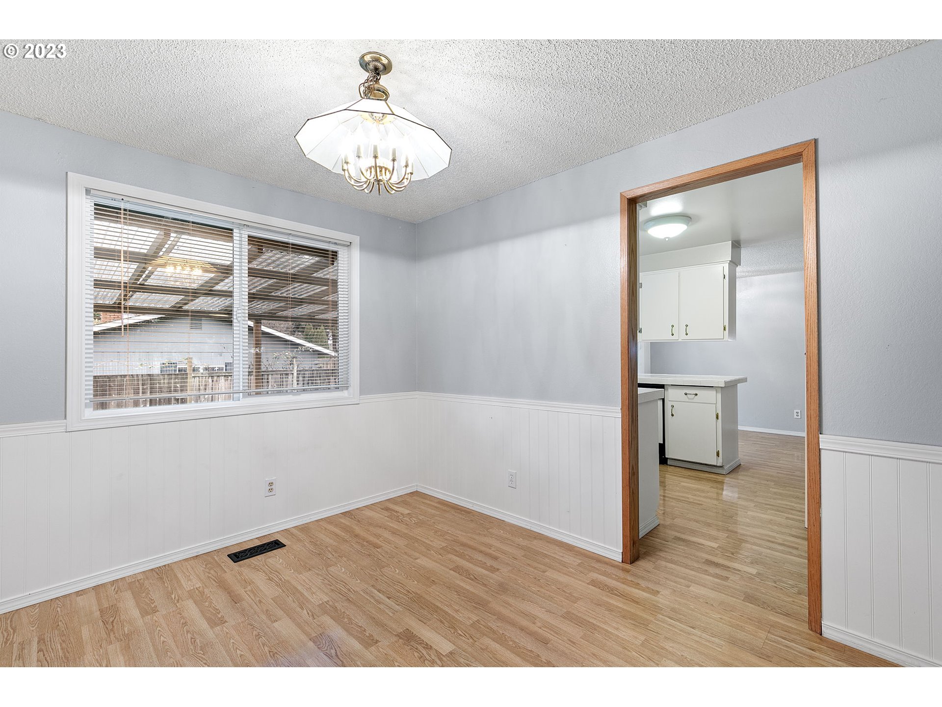 788 70th Street Springfield, OR 97478 - Photo 8 of 39 a view of an empty room with wooden floor and a window