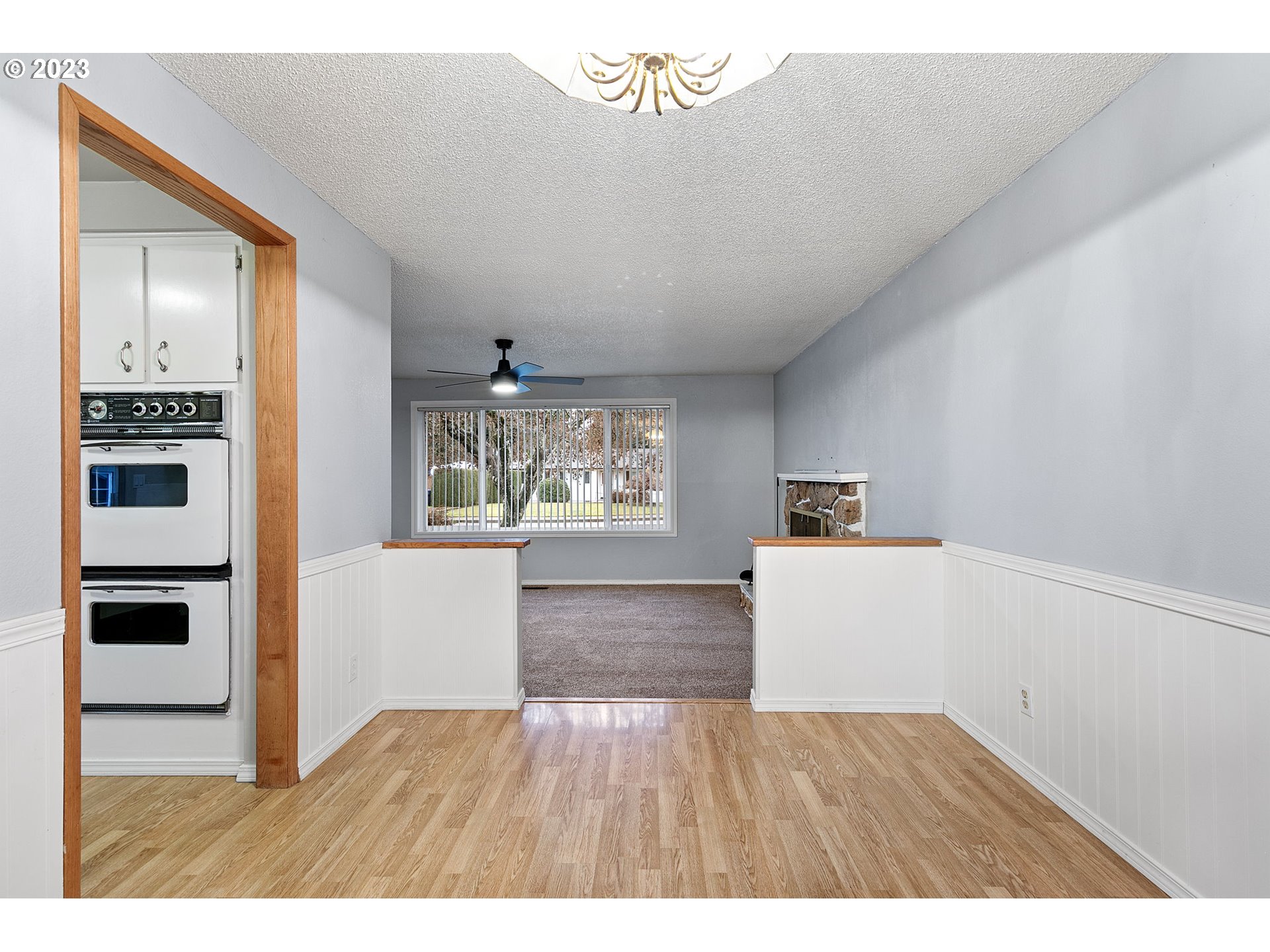 788 70th Street Springfield, OR 97478 - Photo 9 of 39 a view of a living room a window and wooden floor